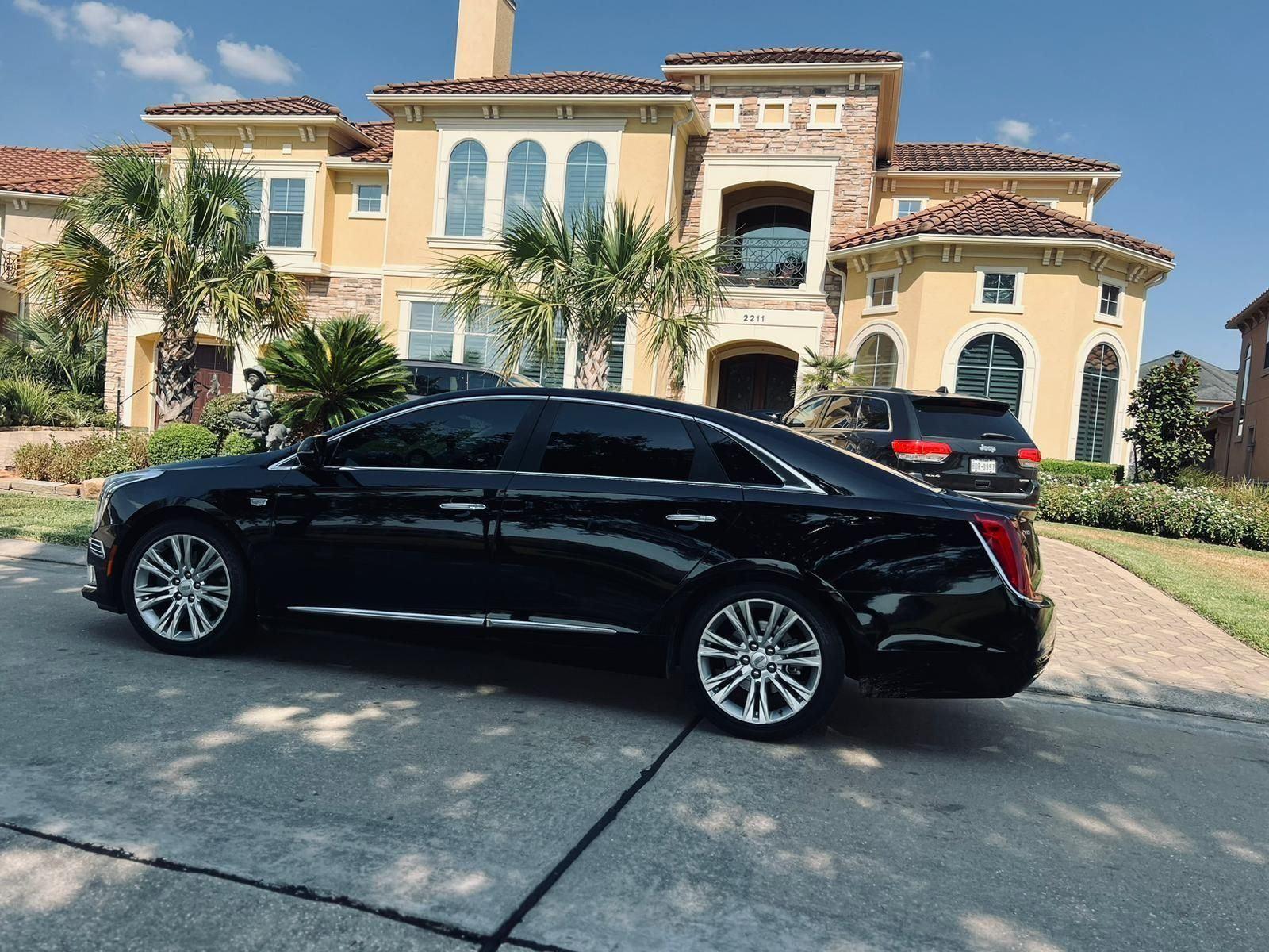 Cadillac XTS sedan mansion — Houston Limo Chauffeur