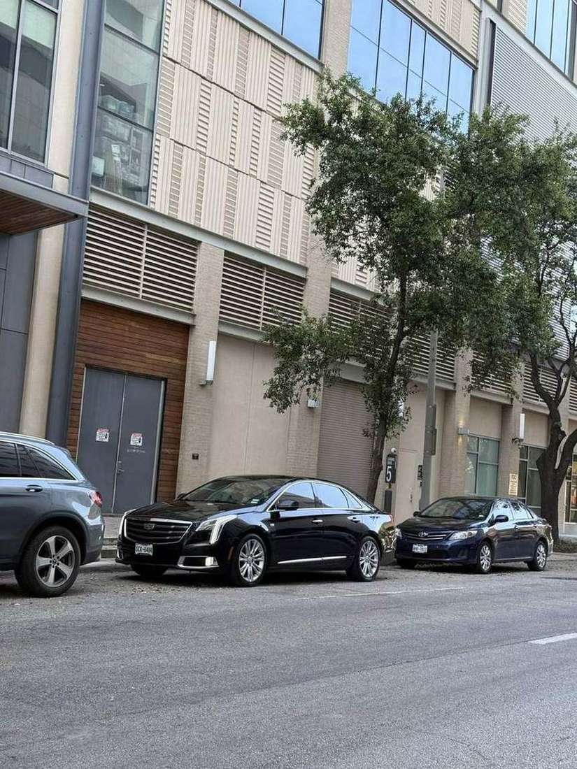 Cadillac XTS sedan street — Houston Limo Chauffeur